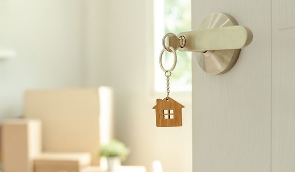 A door unlocked by a key with a house keychain